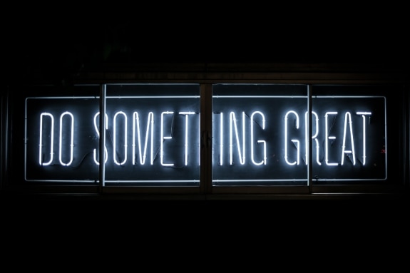 Neon sign that reads 'Do something great'